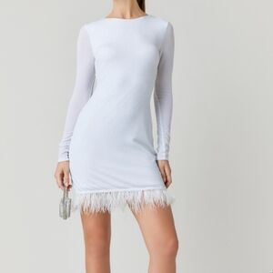 Audrey Parks white mini dress with shine and feathers